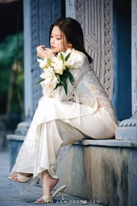 VGU No.131: Explore the Ethereal Beauty of a Vietnamese Lady in White Ao Dai with Lilies-17