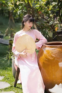Gentle Youthful Beauty in Pink Silk Ao Dai-7