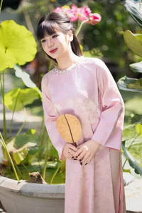Gentle Youthful Beauty in Pink Silk Ao Dai-10