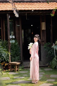 Gentle Youthful Beauty in Pink Silk Ao Dai-9