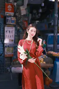 Elegant Vietnamese Beauty: A Girl in Red Ao Dai with Lilies Captivates Urban Charm-7