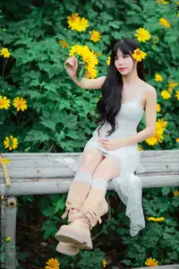 Graceful Young Woman in White Dress Amidst Vibrant Yellow Flowers 1000026997-7