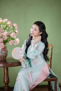 Radiant Elegance in Traditional Blue Attire and Spring Blooms-9