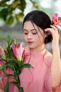 Elegant Pink Ao Dai Amidst Ancient Architecture Capturing Timeless Traditional Beauty-1