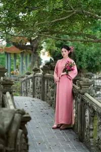 Elegant Pink Ao Dai Amidst Ancient Architecture Capturing Timeless Traditional Beauty-9