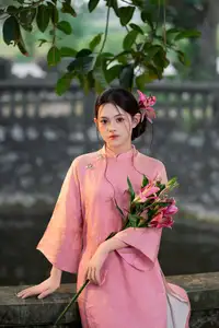 Elegant Pink Ao Dai Amidst Ancient Architecture Capturing Timeless Traditional Beauty-6