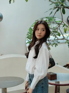 Karen Nguyen radiates effortless elegance in a classic white shirt minimalist look-2