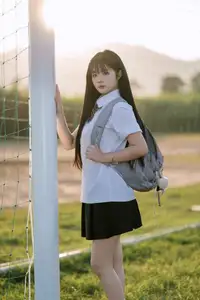 Youthful Schoolgirl in Uniform: Serene Golden Hour Beauty, a Glimpse into Nostalgic Student Life.-4