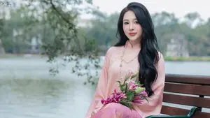 Discover the Elegant Charm of Vietnamese Beauty in a Pink Ao Dai by the Serene Lake-5