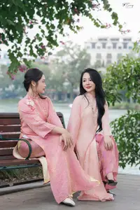 Discover the Elegant Charm of Vietnamese Beauty in a Pink Ao Dai by the Serene Lake-8