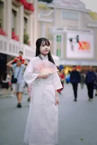 Graceful Vietnamese Girl in White Ao Dai Shines with Traditional Beauty in Old Quarter-4