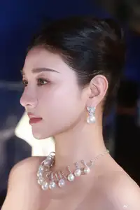 Radiant in Blue: A Woman's Elegant Charm Shines Bright in a Luxurious-1