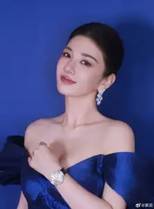 Radiant in Blue: A Woman's Elegant Charm Shines Bright in a Luxurious-0