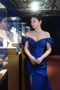 Radiant in Blue: A Woman's Elegant Charm Shines Bright in a Luxurious-6