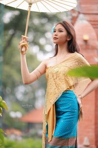 Traditional Vietnamese Beauty: Elegant Lady with Golden Lotus-0