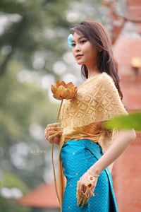 Traditional Vietnamese Beauty: Elegant Lady with Golden Lotus-11
