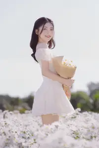 Serene Beauty: Young Woman in White Flower Field, Embracing Tranquility Under Gentle Sunlight-2