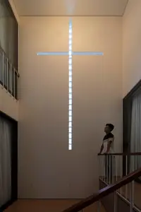 Light-Filled Tube House: Discover Unique Arched Facade & Green Urban Living-7