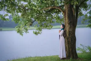 VGU No.172: Captivating Vietnamese Ao Dai Student in a Dreamy Moment, Showcasing Pure Grace Amidst Nature.-6