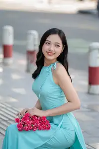 Charming Vietnamese Girl in Turquoise Ao Dai: Elegant Beauty on City Streets-7