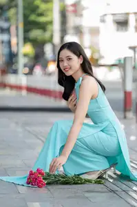 Charming Vietnamese Girl in Turquoise Ao Dai: Elegant Beauty on City Streets-0