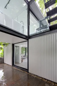 Minimalist Sanctuary: Elevating Modern Living with Floor-to-Ceiling Glass Walls and Lush Indoor Greenery-2