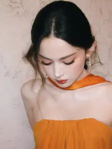 Captivating Beauty: Goddess in a Vibrant Orange Gown, Exuding Elegant Allure.-1