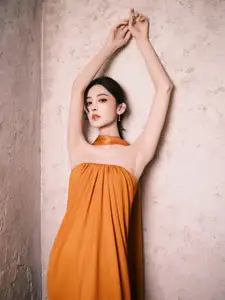 Captivating Beauty: Goddess in a Vibrant Orange Gown, Exuding Elegant Allure.-9