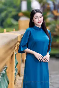 Vietnamese Ao Dai Charm: Elegant Lady in Teal Blue Dress, A Captivating Vision of Grace-0