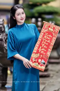 Vietnamese Ao Dai Charm: Elegant Lady in Teal Blue Dress, A Captivating Vision of Grace-6