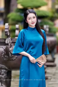 Vietnamese Ao Dai Charm: Elegant Lady in Teal Blue Dress, A Captivating Vision of Grace-4