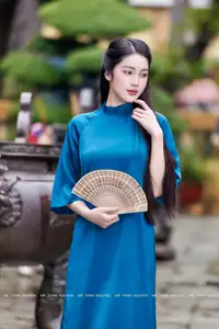 Vietnamese Ao Dai Charm: Elegant Lady in Teal Blue Dress, A Captivating Vision of Grace-5