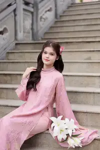 Graceful Pink Ao Dai: Vietnamese Girl showcases traditional beauty on ancient stairs-0