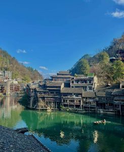 Discover Fenghuang Ancient Town: Serene boat ride, historic riverside charm.-8