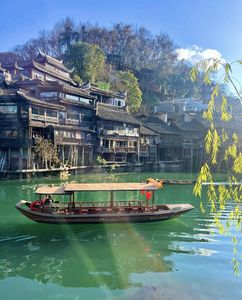 Discover Fenghuang Ancient Town: Serene boat ride, historic riverside charm.-6