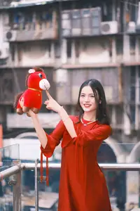 Vietnamese Girl's Bright Smile with Lucky Plush Horses in a Traditional Market.-1