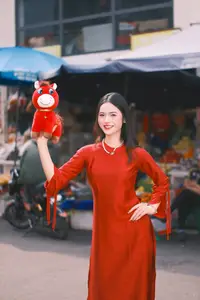 Vietnamese Girl's Bright Smile with Lucky Plush Horses in a Traditional Market.-5
