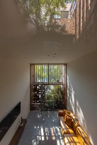 Modern Tube House Design: Innovative Urban Architecture with Lush Indoor Gardens and Natural Light Voids in Hanoi-0