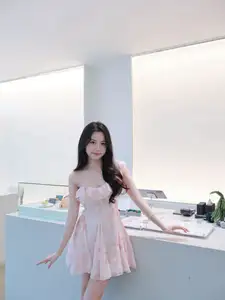 Gentle Charm: Beautiful Girl in Pink Floral Dress, Captivating Elegant Style.-1