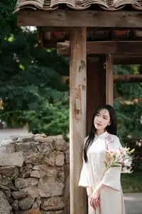 Timeless Elegance: Vietnamese Woman in Traditional Ao Dai Amidst Serene Backdrop-5