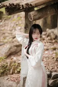 Timeless Elegance: Vietnamese Woman in Traditional Ao Dai Amidst Serene Backdrop-11