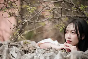 Timeless Elegance: Vietnamese Woman in Traditional Ao Dai Amidst Serene Backdrop-1