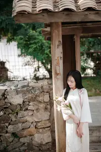 Timeless Elegance: Vietnamese Woman in Traditional Ao Dai Amidst Serene Backdrop-6