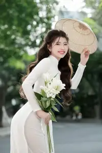 Vietnamese Schoolgirl Gracefully in Pure White Ao Dai Traditional Conical Hat and Lilies-8