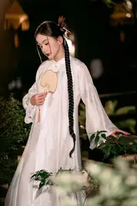Enchanting Vietnamese Beauty A Girl with Long Braids in Traditional Attire on a Magical Night-0