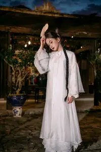 Enchanting Vietnamese Beauty A Girl with Long Braids in Traditional Attire on a Magical Night-4