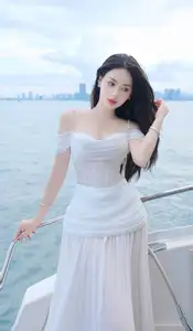 Elegant Beauty on the Waves: White Dress Muse Cruises the Azure Sea-0