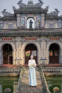 Graceful Ao Dai: The Ethereal Beauty of a Vietnamese Woman with White Orchids, Inspiring Tradition.-8
