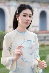 Graceful Ao Dai: The Ethereal Beauty of a Vietnamese Woman with White Orchids, Inspiring Tradition.-3