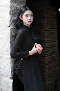 Timeless Beauty: Graceful Vietnamese Lady in Black Ao Dai Captivates with Asian Elegance.-10